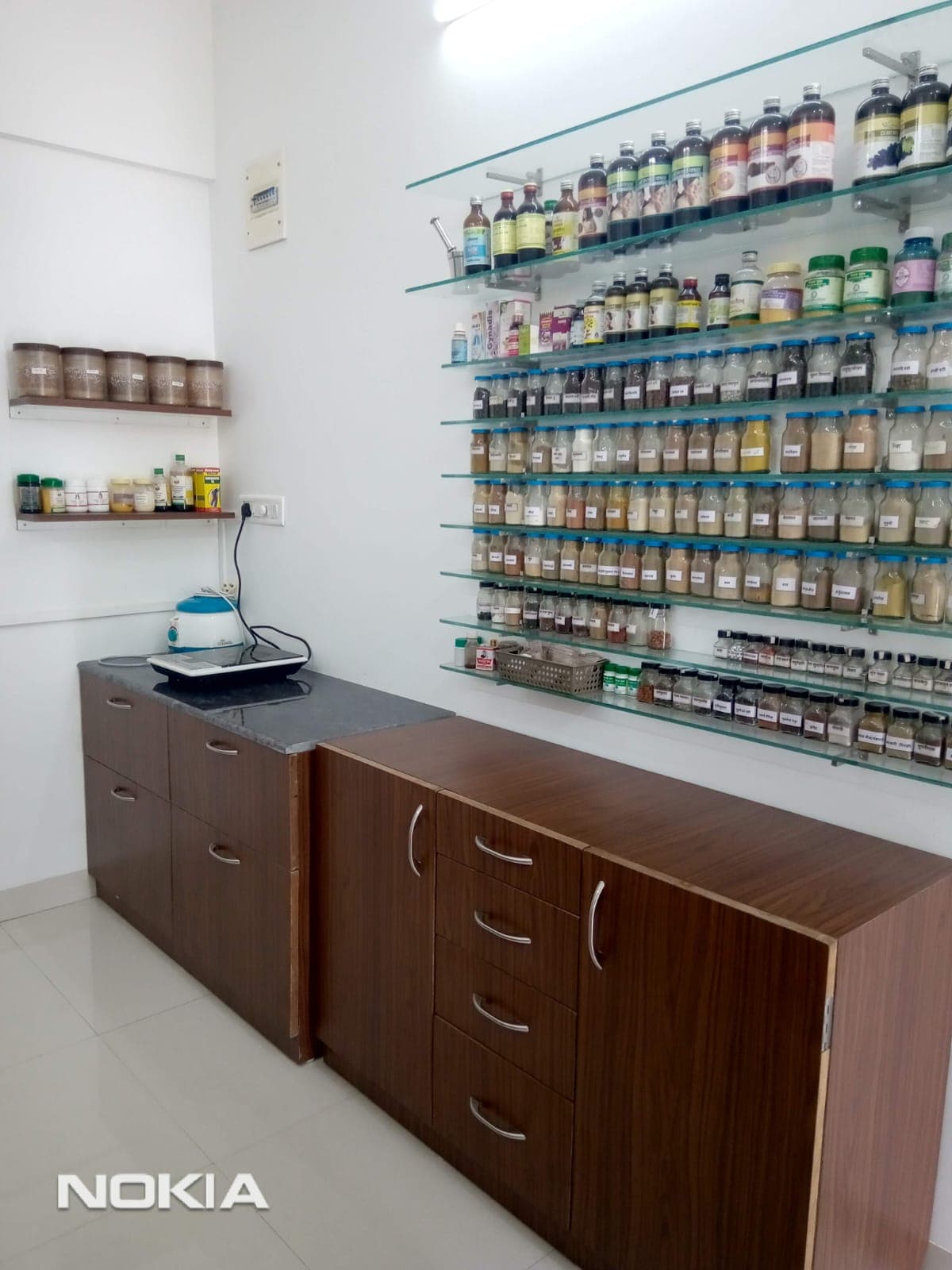 Dispensary cabinet stocked with Ayurvedic medicines